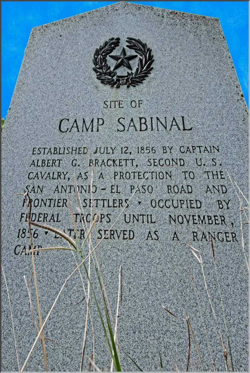 A monument that is in the grass.