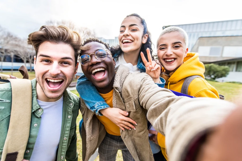 A group of people taking a selfie together.